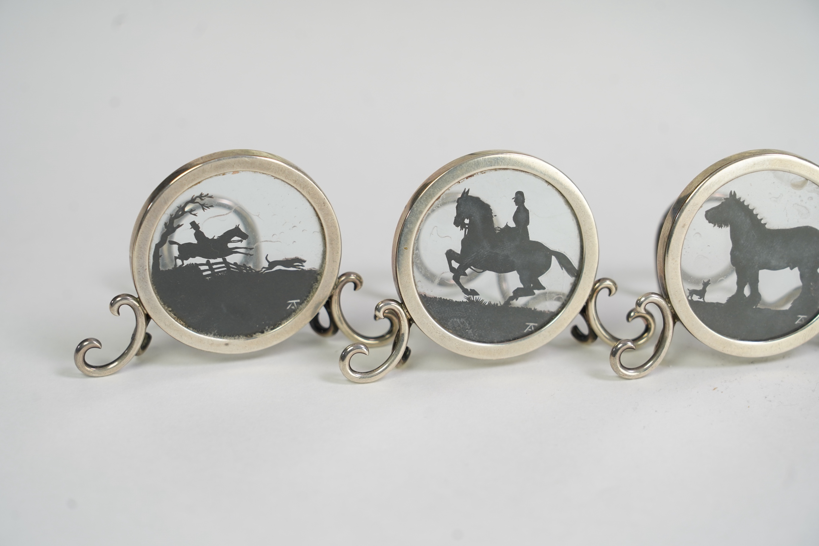 A set of four Edwardian silver menu holders, by Elkington & Co